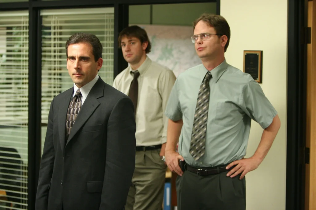 Image of "The Office" cast, showcasing Michael Scott, Jim Halpert, Pam Beesly, and Dwight Schrute at Dunder Mifflin.